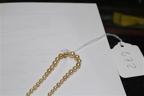 A single strand graduated natural pearl necklace, with old cut diamond cluster set yellow metal clasp.